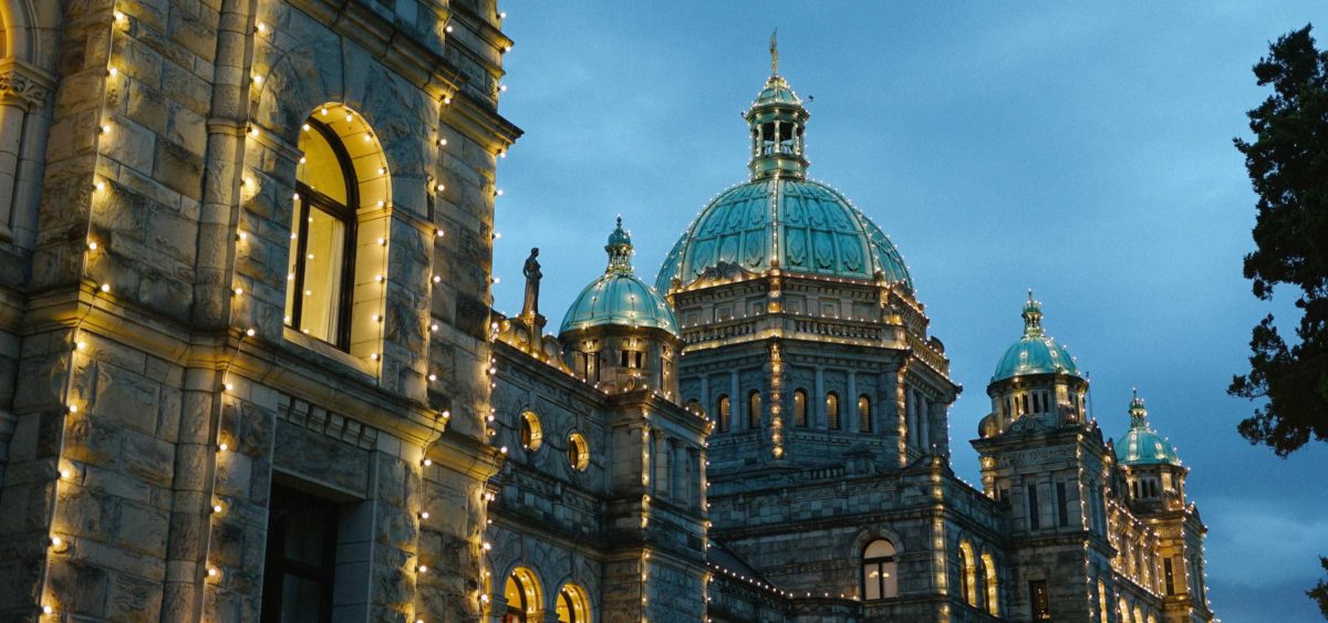 Victoria's iconic Parliament Buildings glow after sunset.